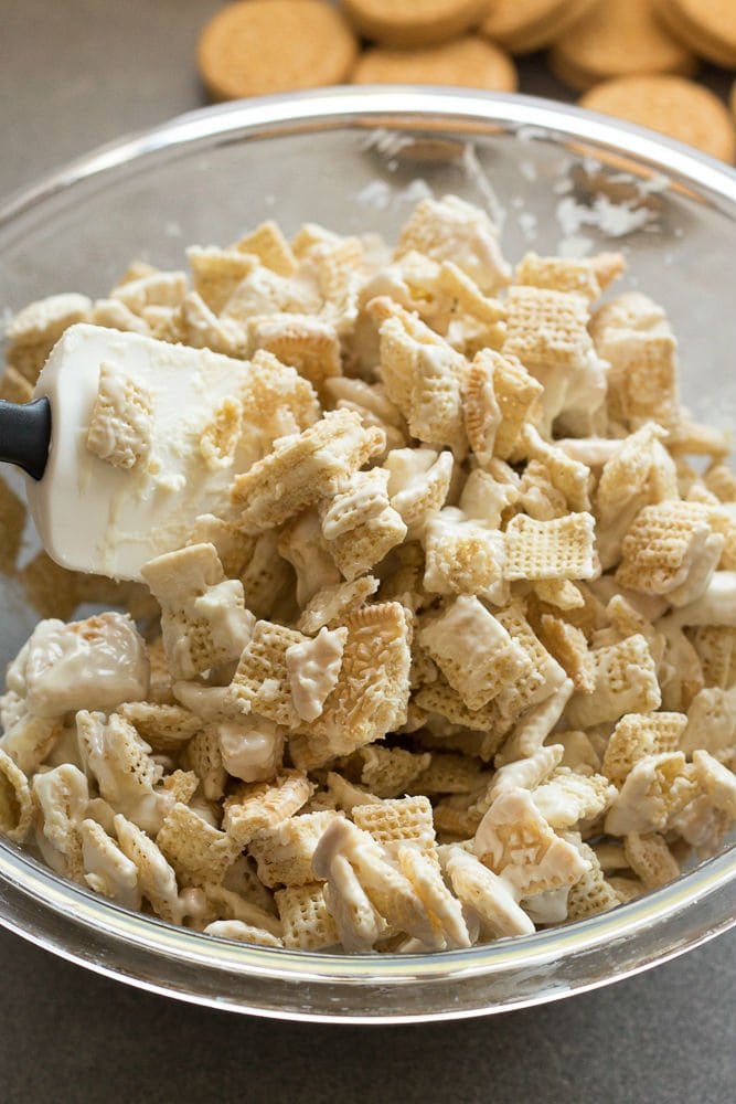 Chex cereal and chopped oreos in a mixing bowl with white chocolate